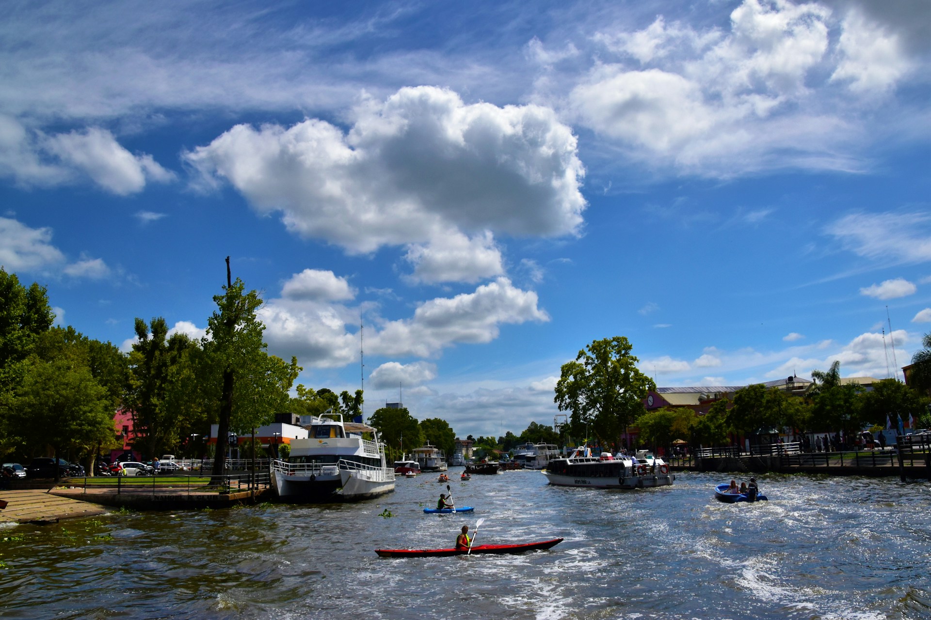 a group of people in a boat on a body of water