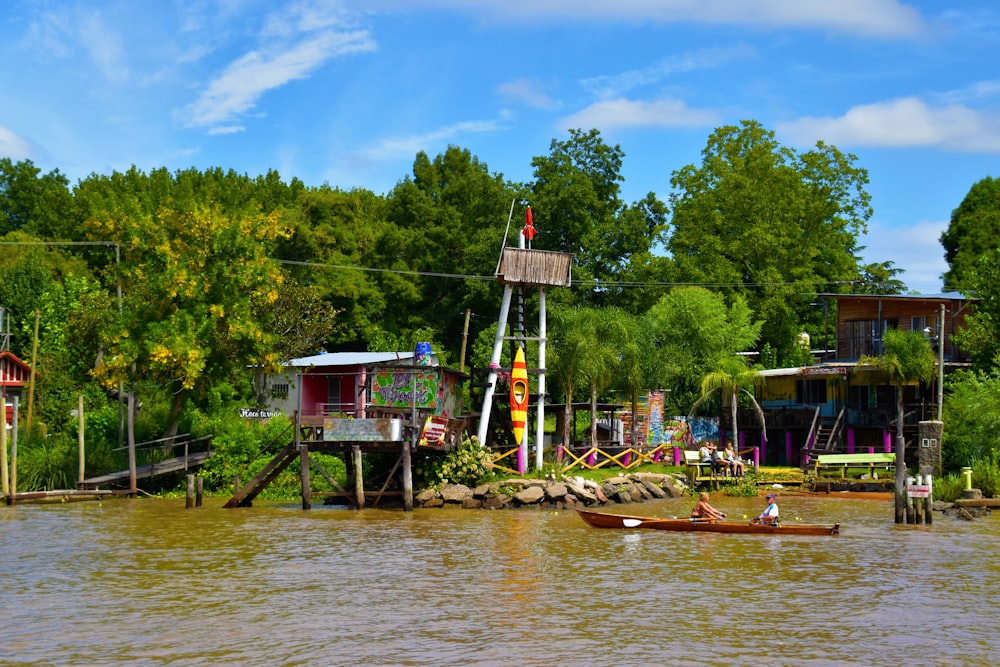 a couple of small boats floating on top of a river