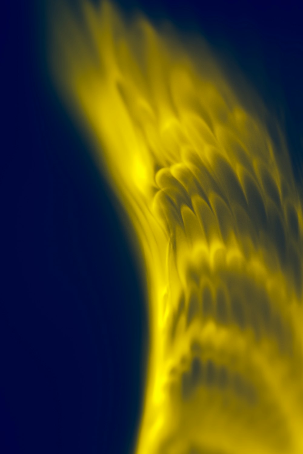 a close up of a yellow object in the sky
