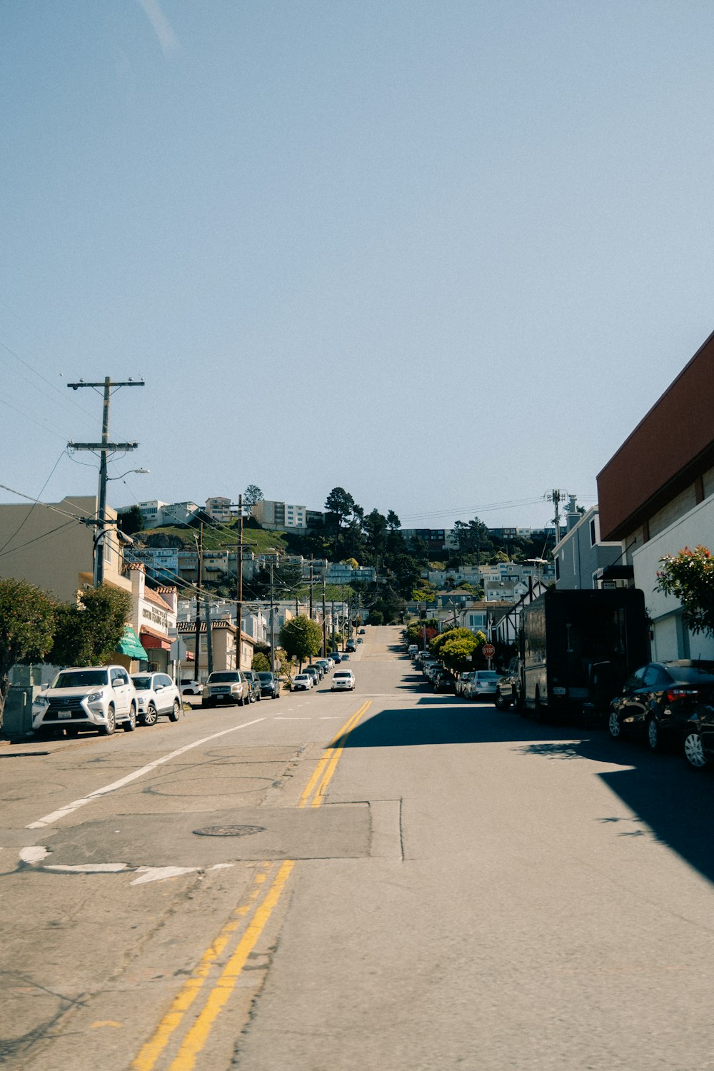 a street with cars parked on both sides of it