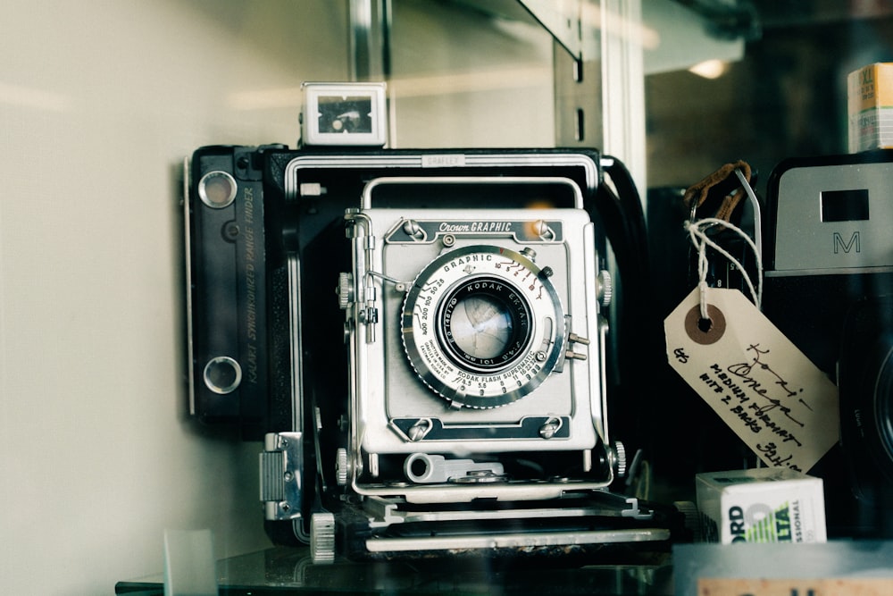 an old camera sitting on top of a table