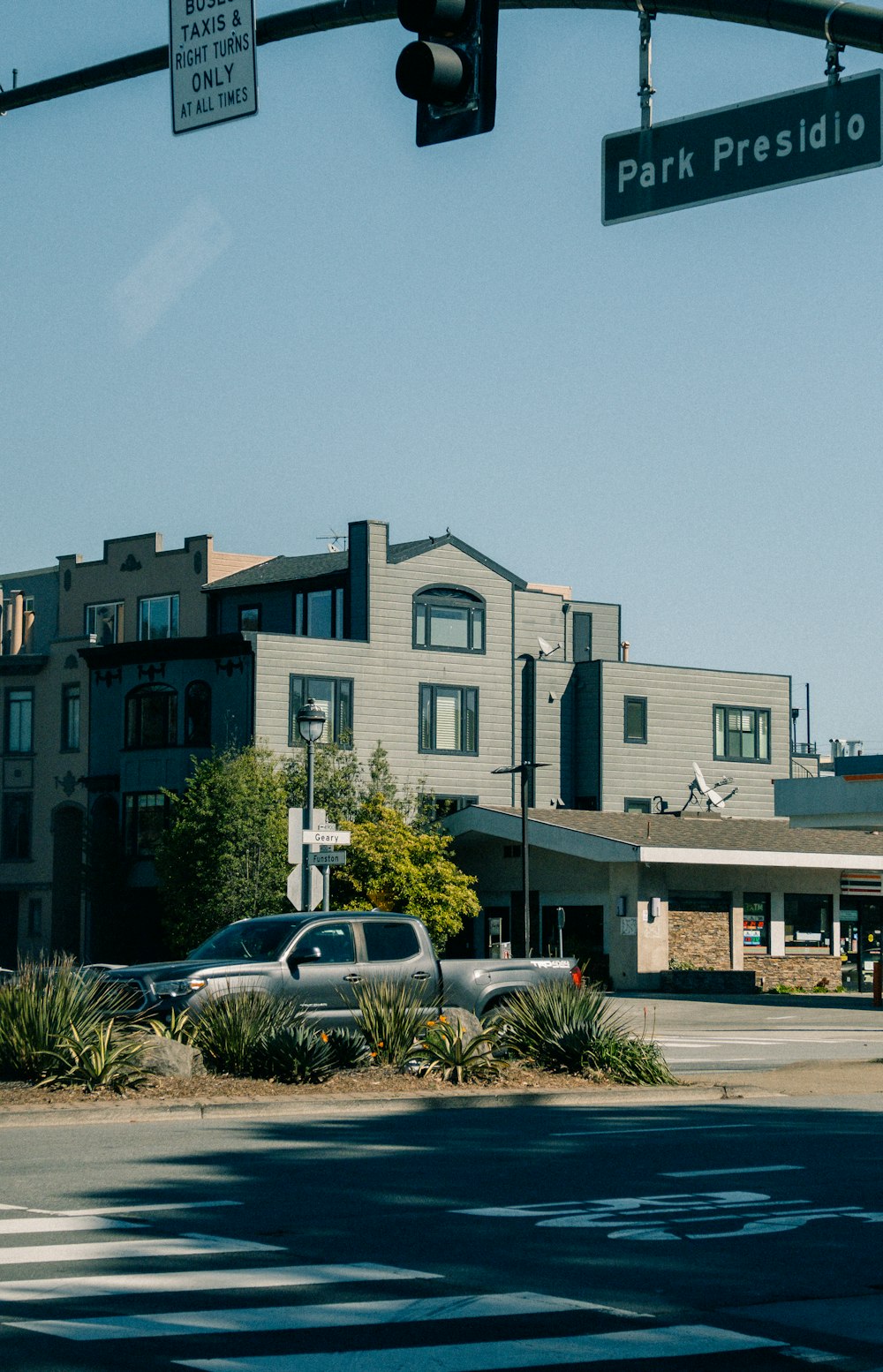 a traffic light that is hanging over a street