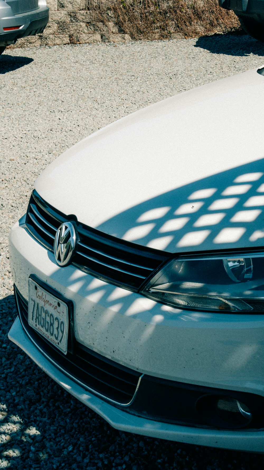 a white car parked in a parking lot