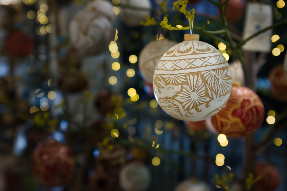 a close up of a christmas ornament hanging from a tree