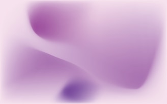 A creative ombre effect transitioning from soft lavender to deep purple on almond-shaped nails.