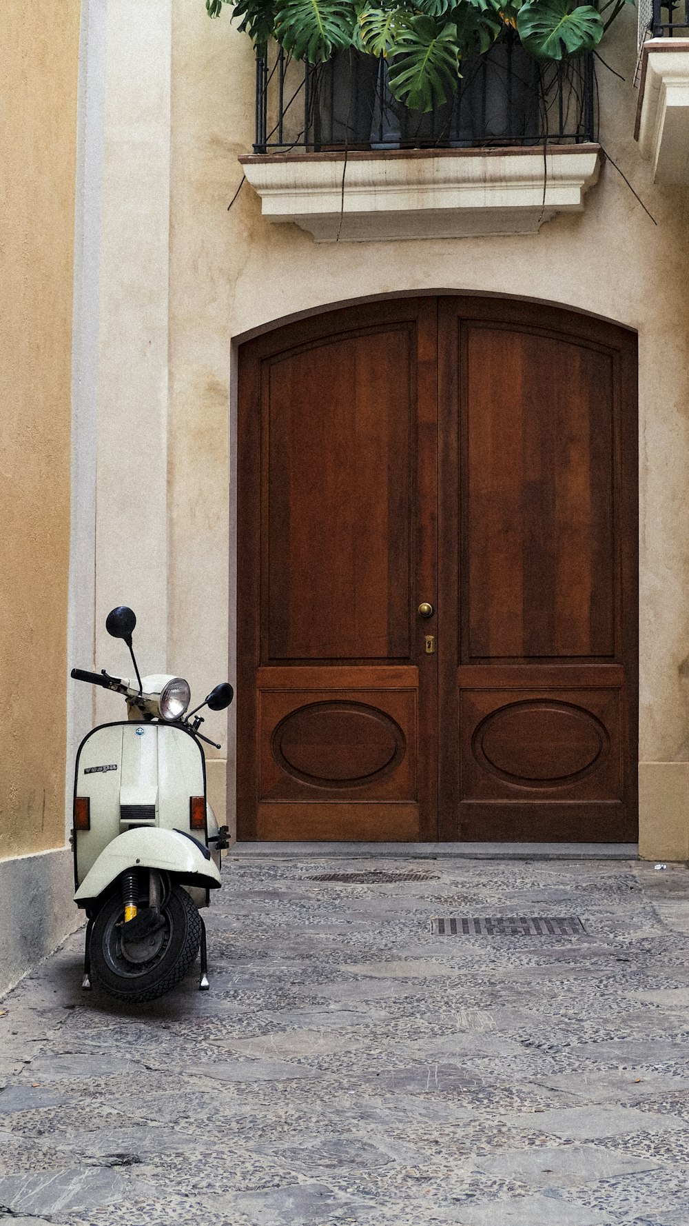 a scooter is parked in front of a door