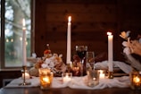 A cozy dinner setting for two with candles.
