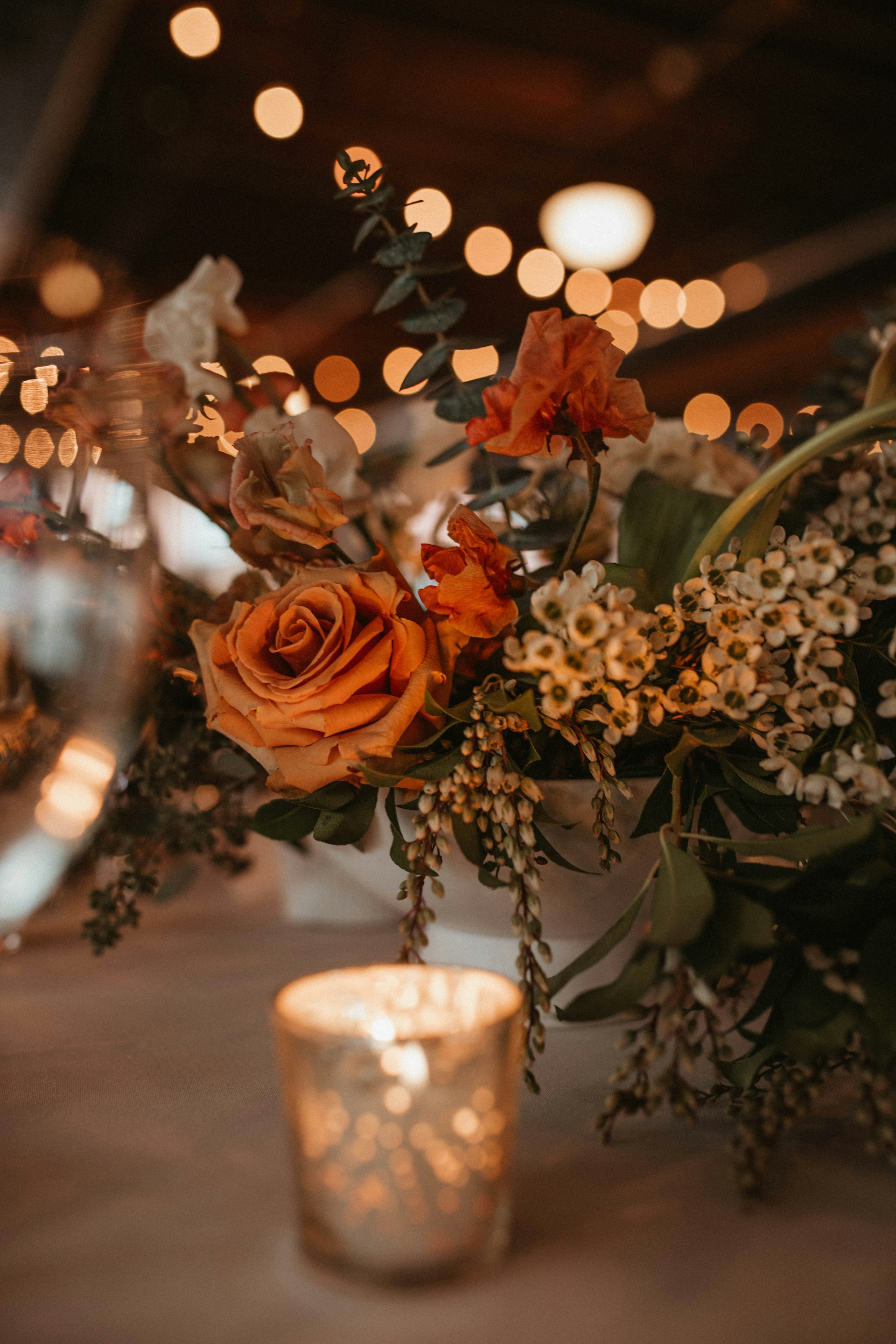a vase filled with flowers sitting on top of a table