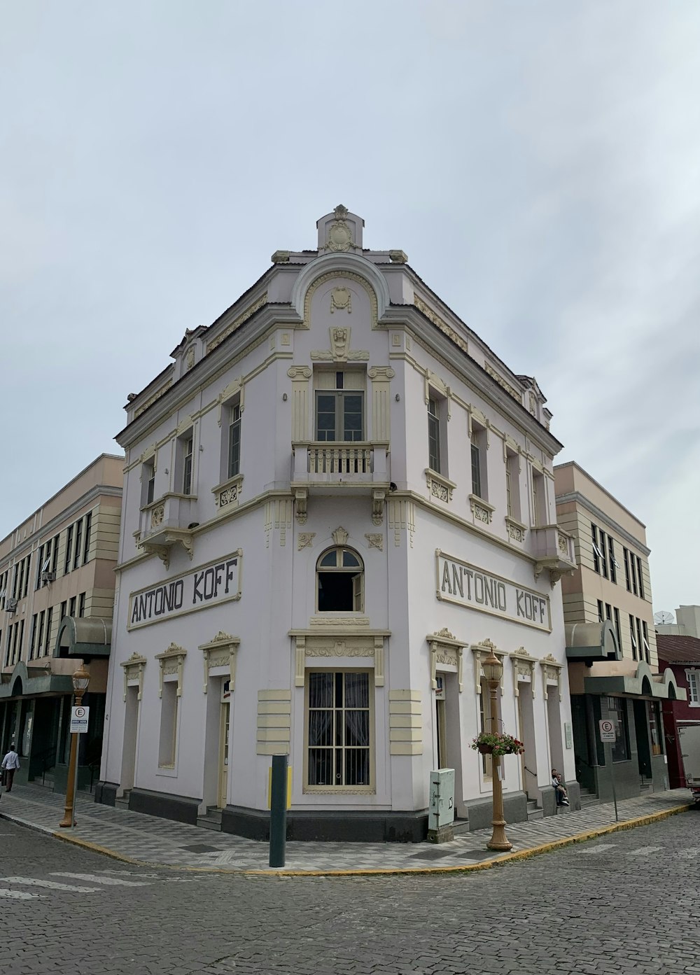 a white building with a clock on the front of it