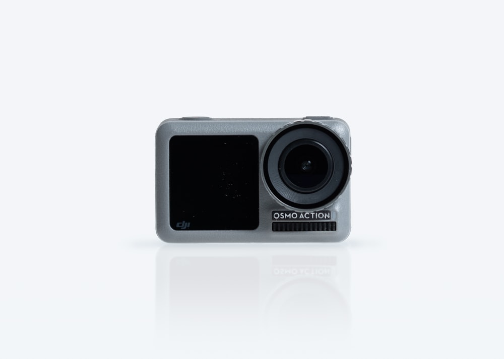 an action camera is shown on a white surface