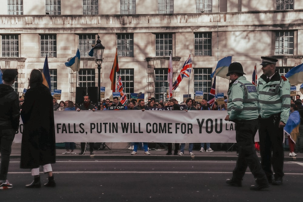 a group of people that are standing in the street