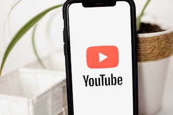 a cell phone with a youtube logo on it