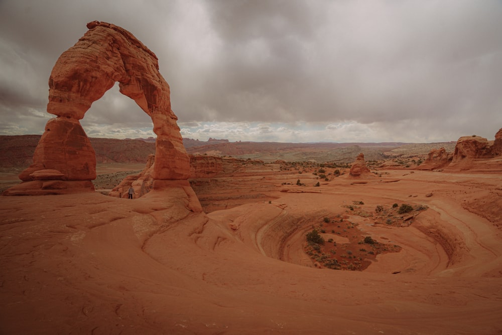 a large rock formation in the middle of a desert