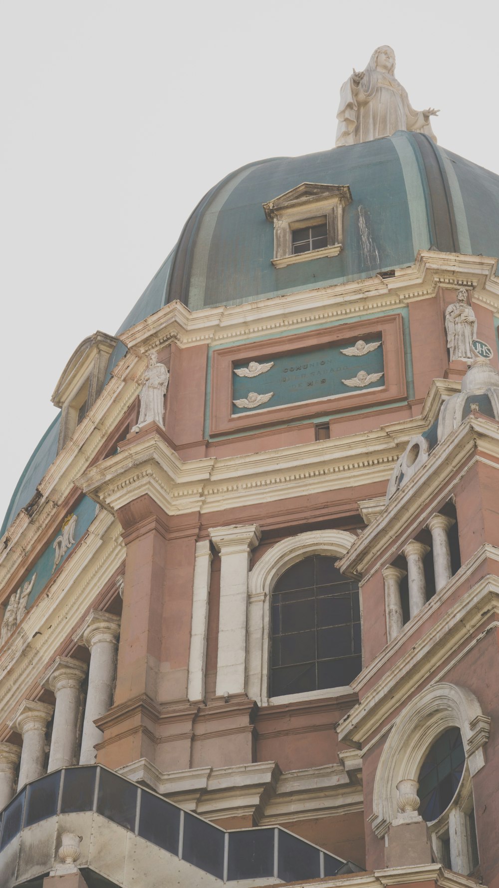 a large building with a clock on the top of it