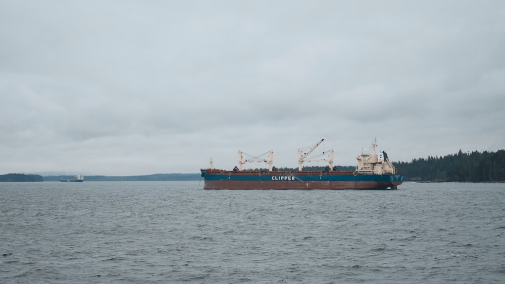 a large cargo ship in the middle of a body of water
