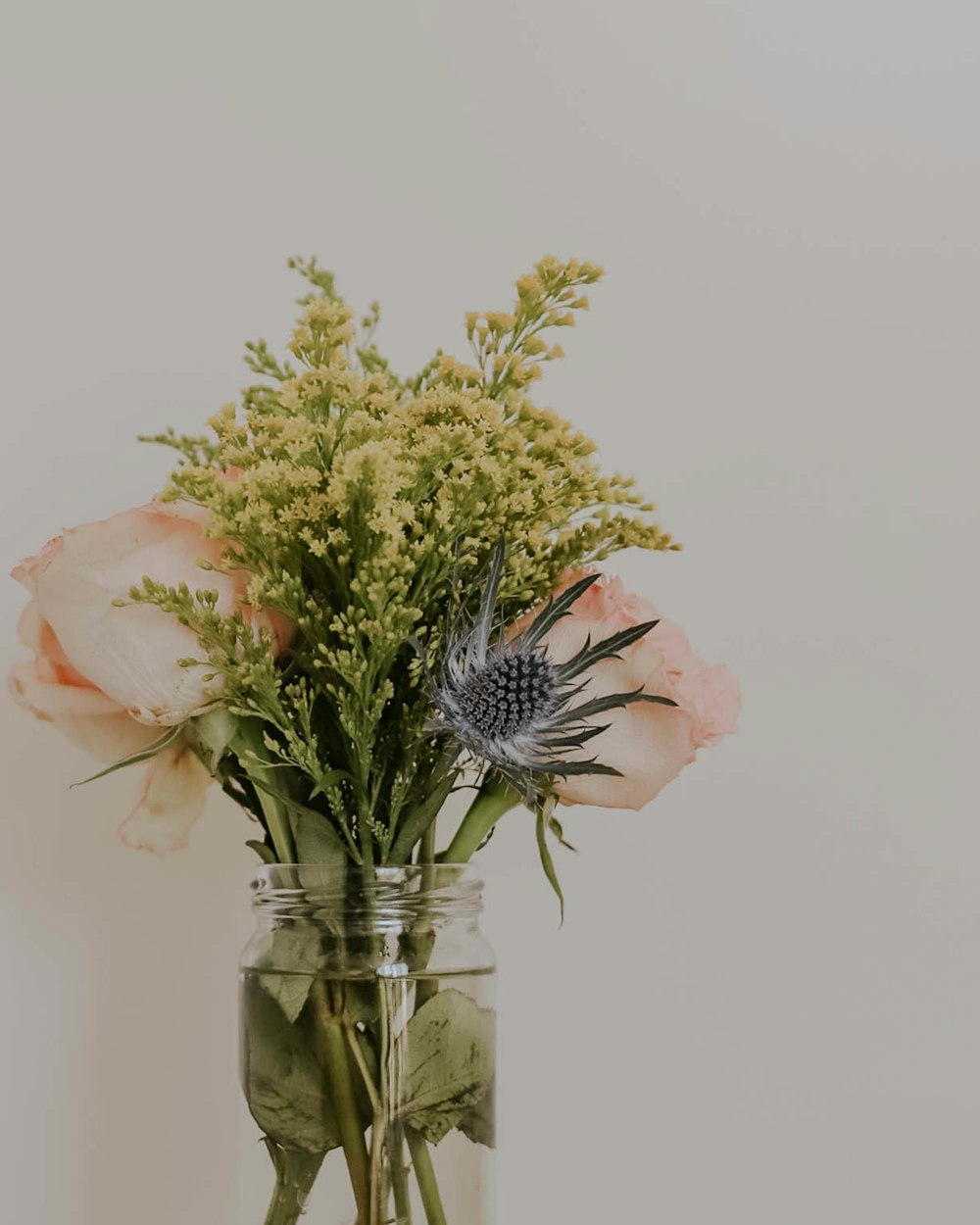 a vase filled with flowers on top of a table