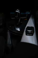 Close-up of a high-quality gear shifter assembly with sleek metallic finish.