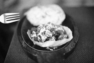 a black and white photo of a plate of food