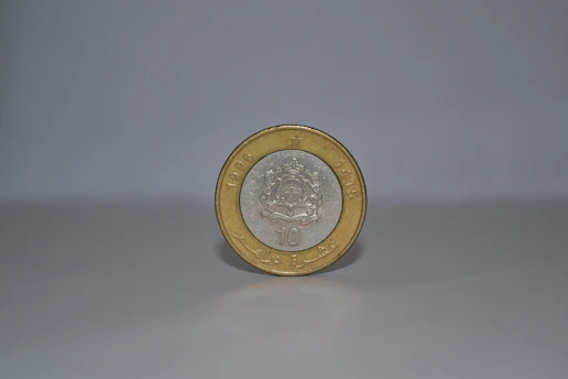 Close-up of a shining silver coin from the Mexico 2026 football commemorative set, resting on an elegant dark velvet background.