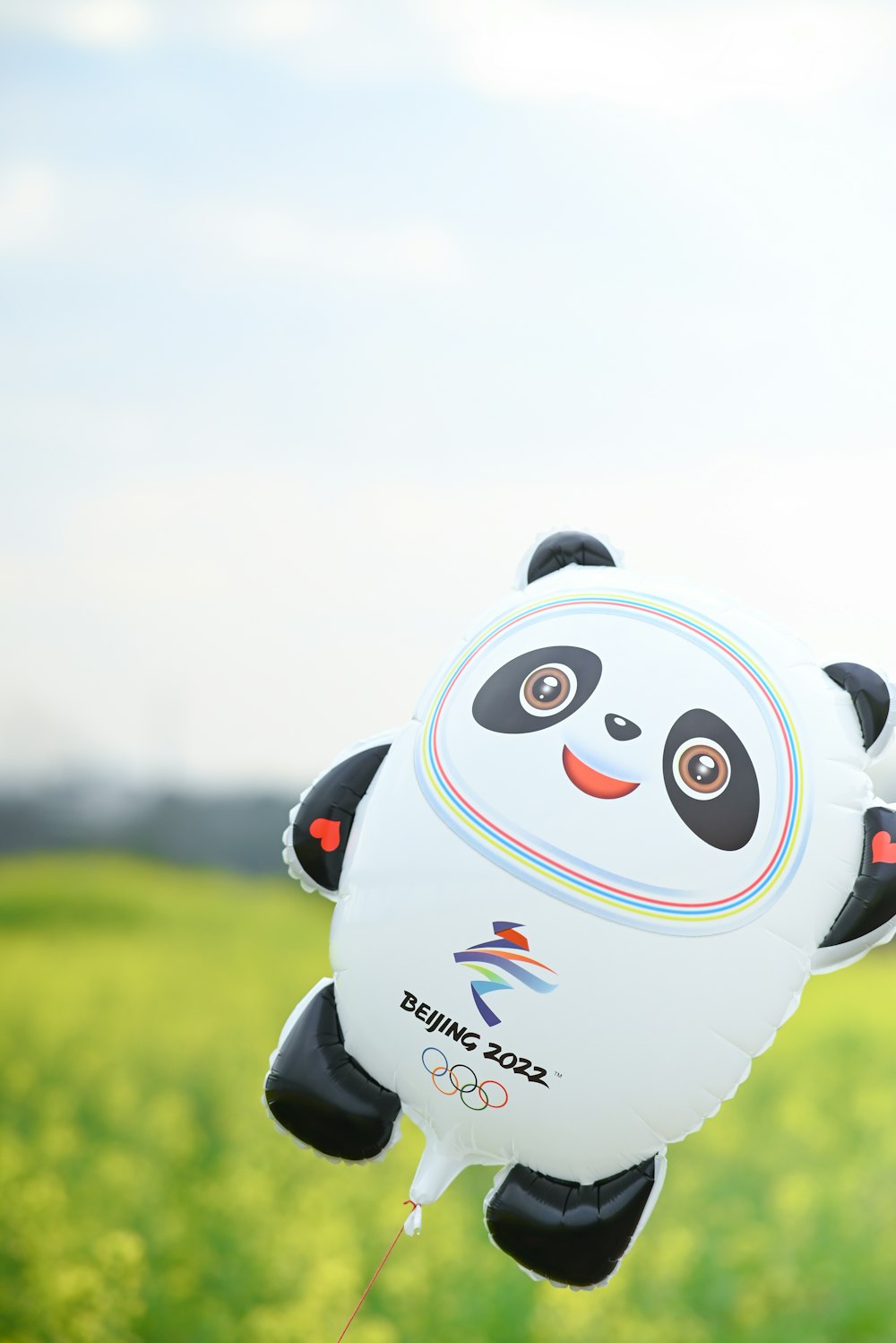 a panda bear shaped kite flying in the air