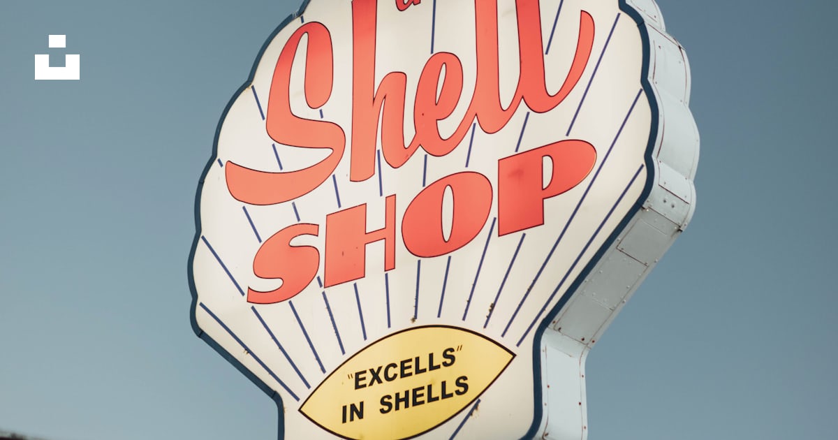 A shell shop sign on top of a building photo – Free Morro bay Image on ...