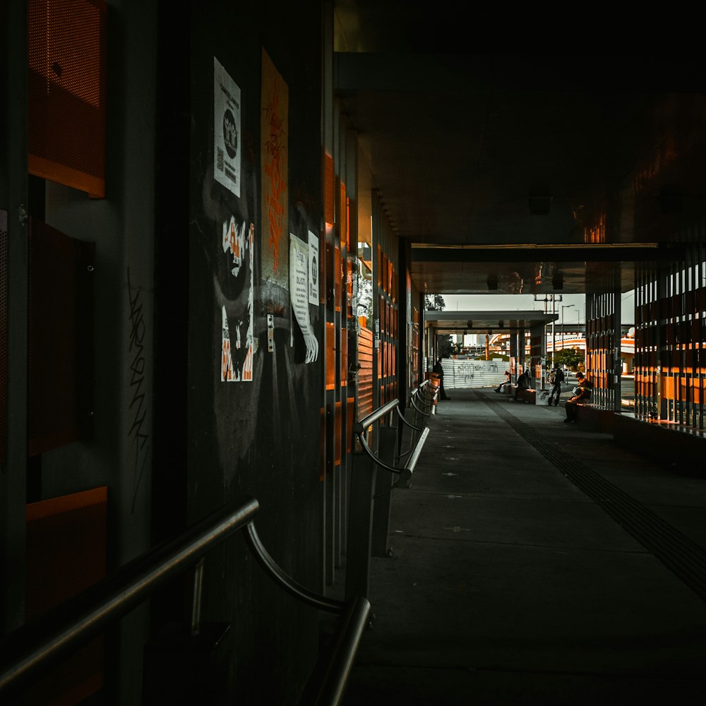 a dark hallway with orange and black walls