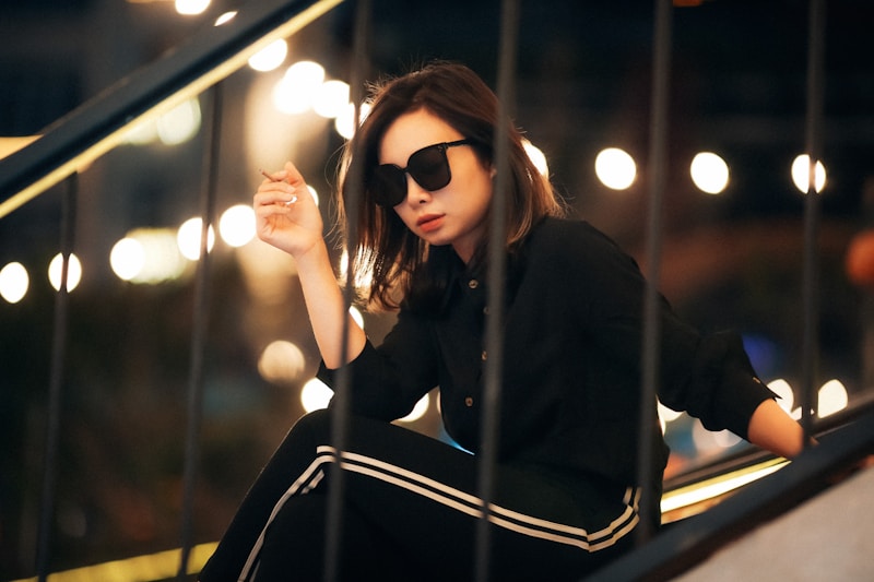 Chic sunglasses staircase pose