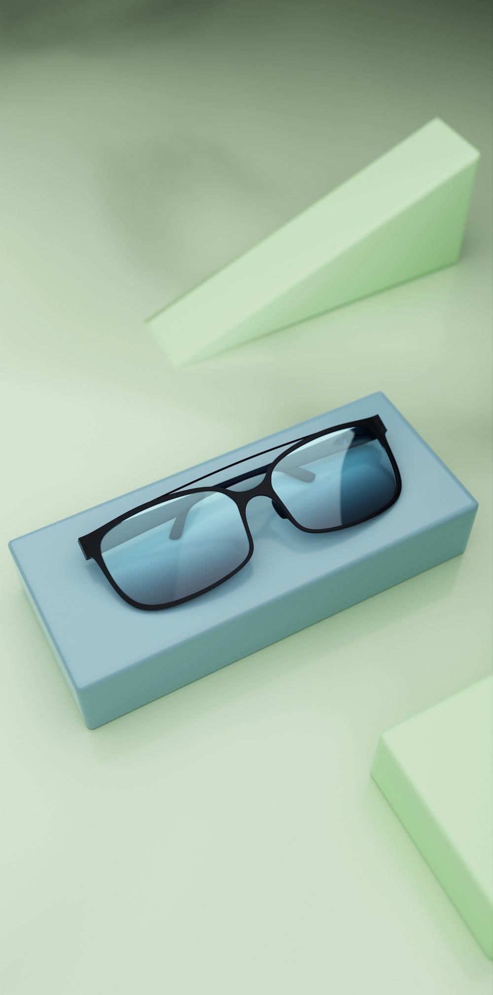 a pair of sunglasses sitting on top of a blue box