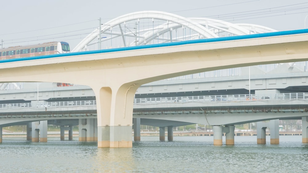 a train on a bridge over a body of water