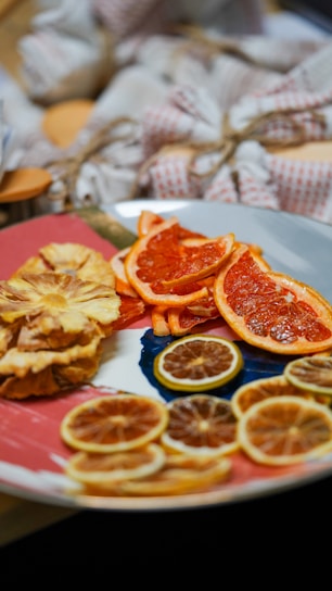 Close-up of beautifully arranged dried citrus slices glowing under warm light.