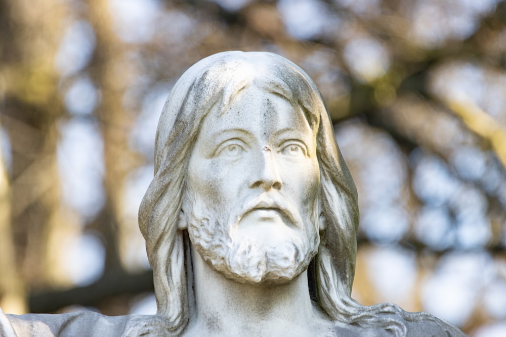 a statue of a man with long hair and a beard