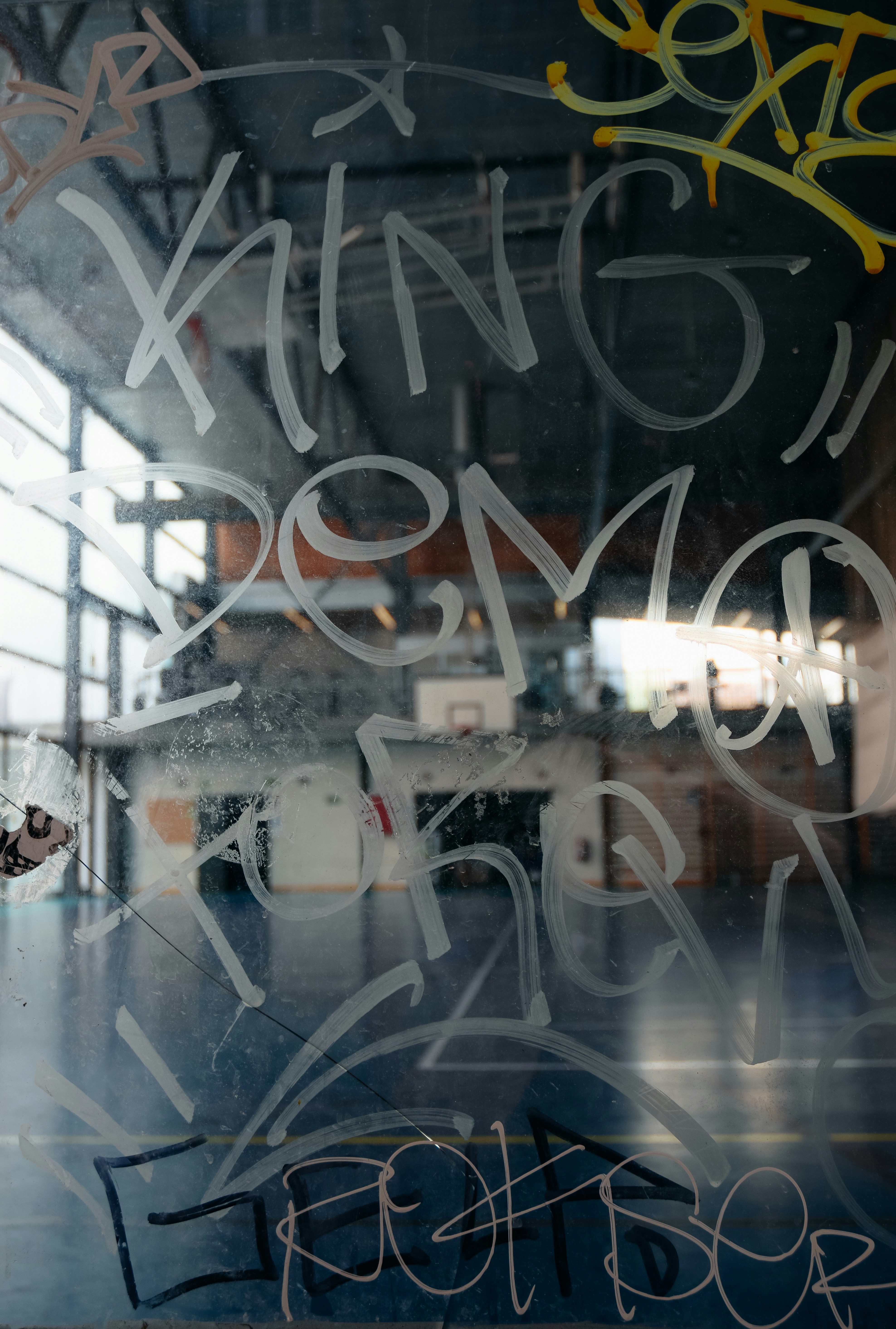 a man riding a skateboard on top of a wooden floor