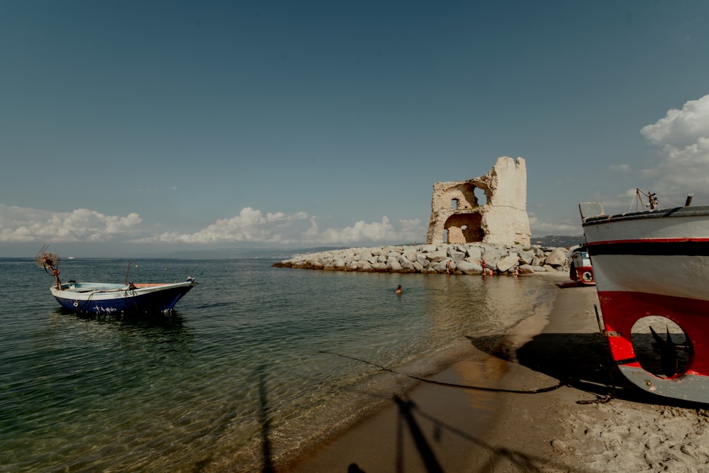 a small boat sitting on top of a body of water