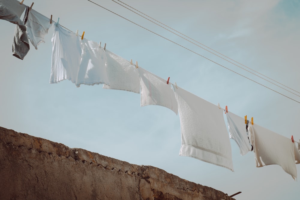 a line of clothes hanging on a clothes line