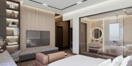 a bedroom with a large bed and a flat screen tv