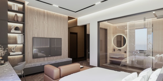 a bedroom with a large bed and a flat screen tv