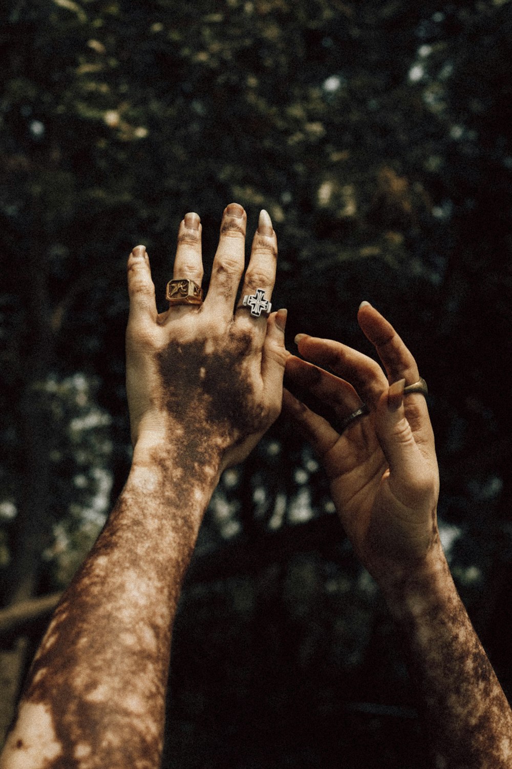 a couple of people that are holding up their hands