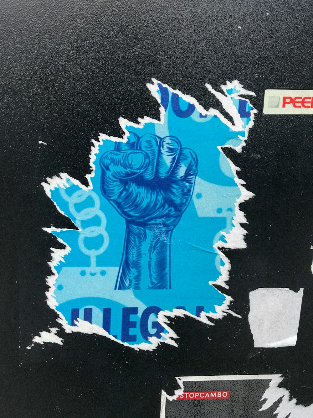 a close up of a sticker of a fist