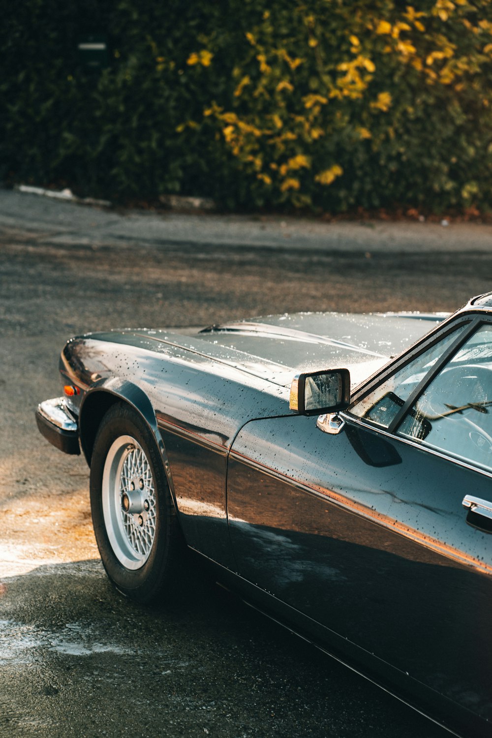 a black sports car parked on the side of the road