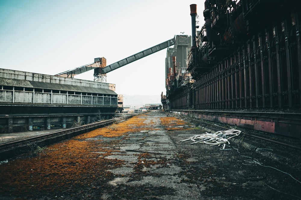 a train track with a building in the background