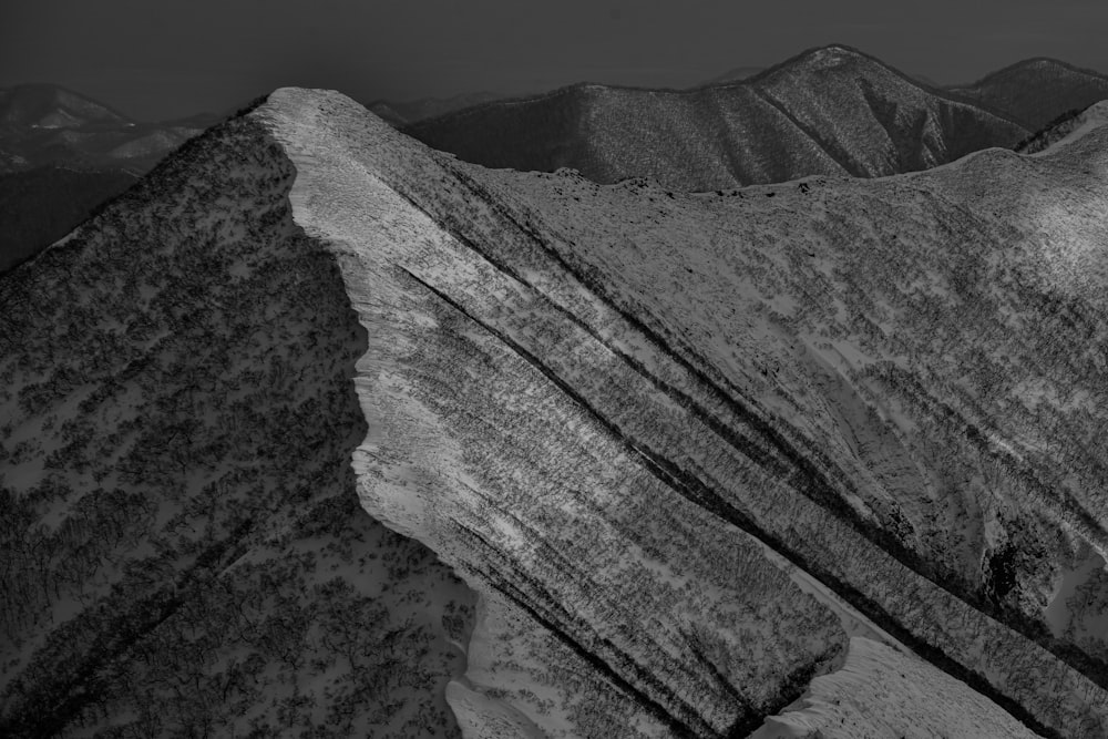 a black and white photo of a mountain range