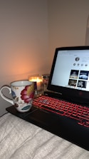 A cozy setting featuring a laptop displaying a live chat window with a smiling woman.