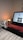 A cozy home setting with a laptop open to an online shopping site.