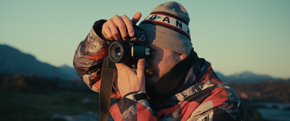 a man taking a picture with a camera