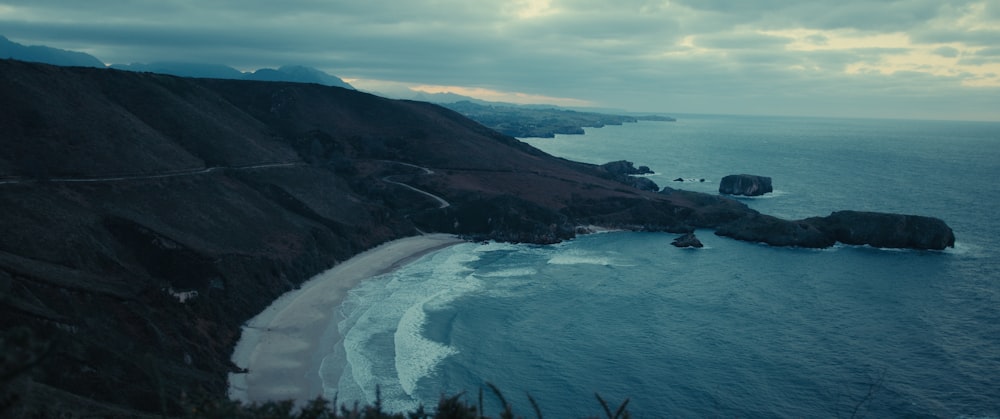 a scenic view of a beach and ocean