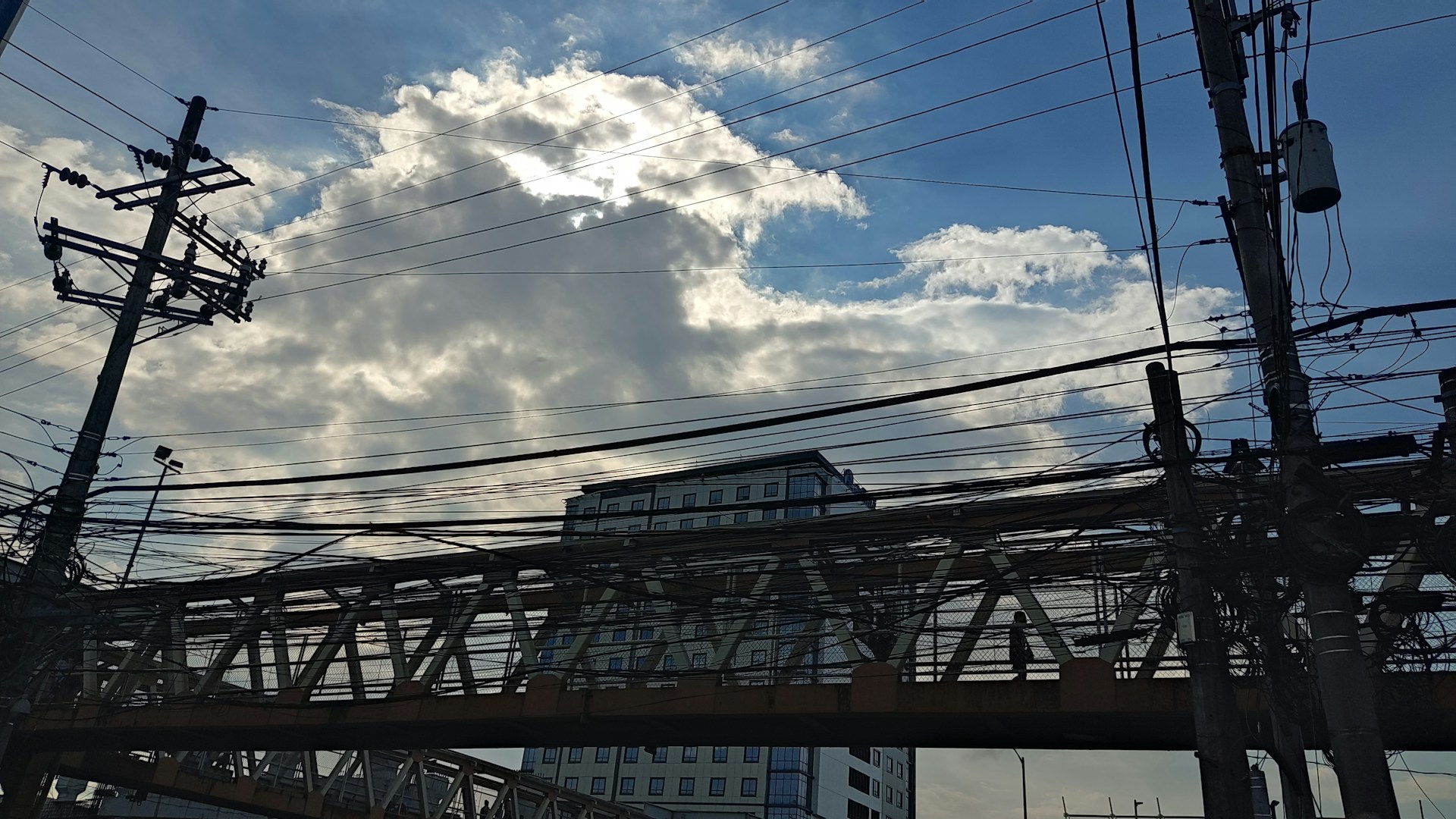 woman wearing yellow long-sleeved dress under white clouds and blue sky during daytime