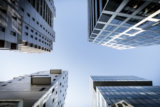 looking up at tall buildings in a city