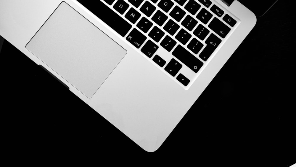 a laptop computer sitting on top of a desk