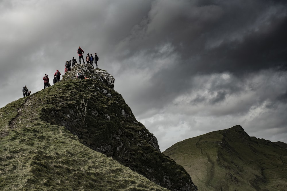 a group of people on a rocky hill