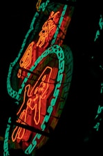 A vibrant neon green digital cityscape glowing against a deep black background, symbolizing viral energy.